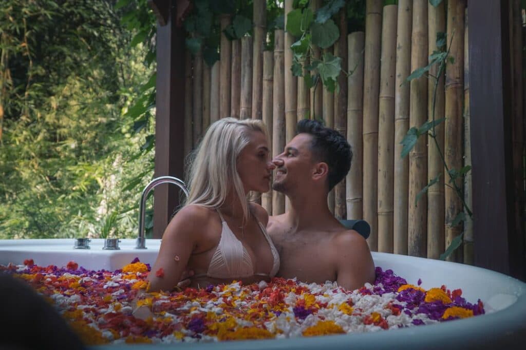 Picture a warm massage surrounded by a variety of flowers and fruits, rejuvenating your senses and lifting your spirits.