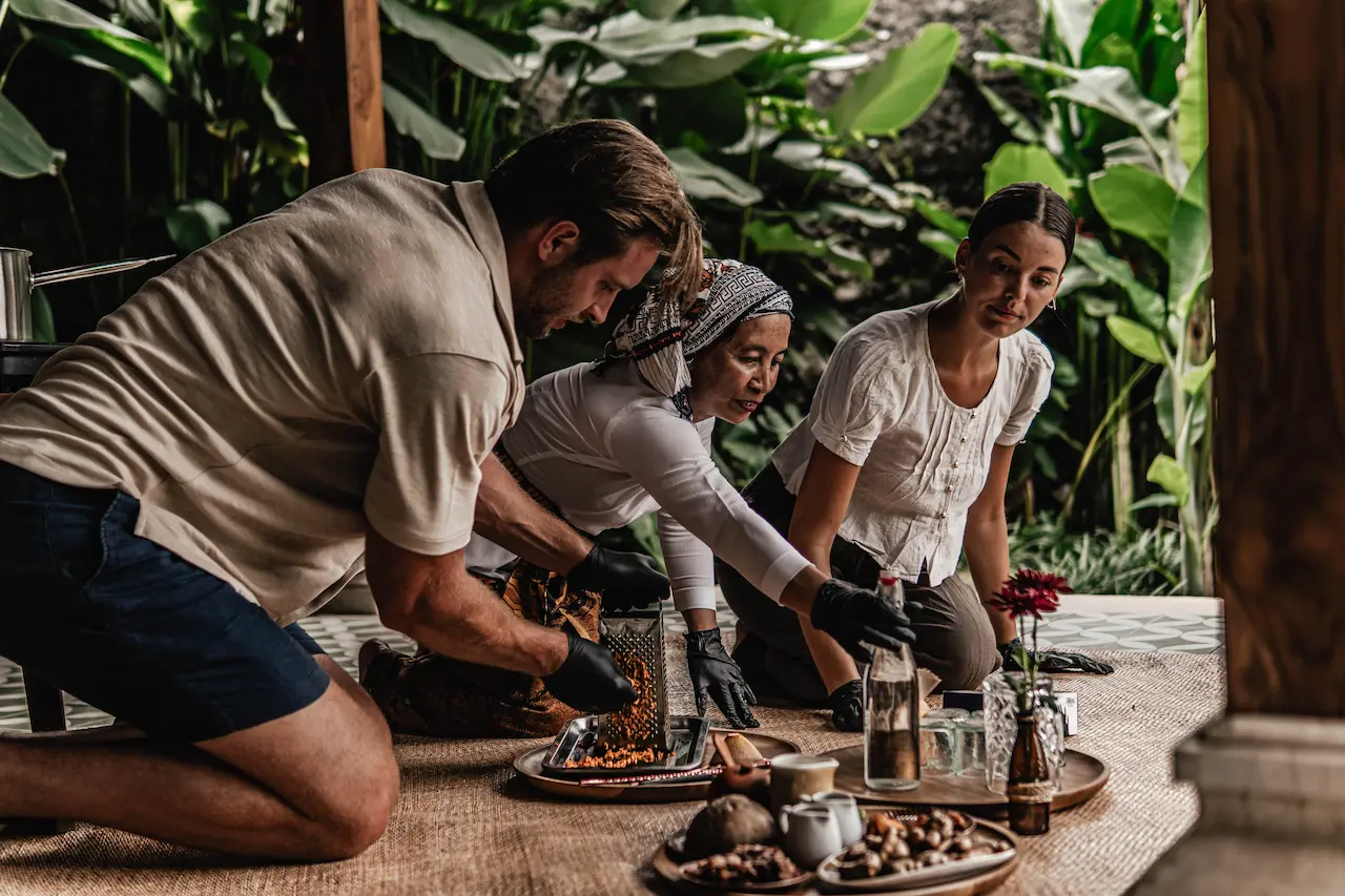Niang Maar making a traditional herbal drink with guests