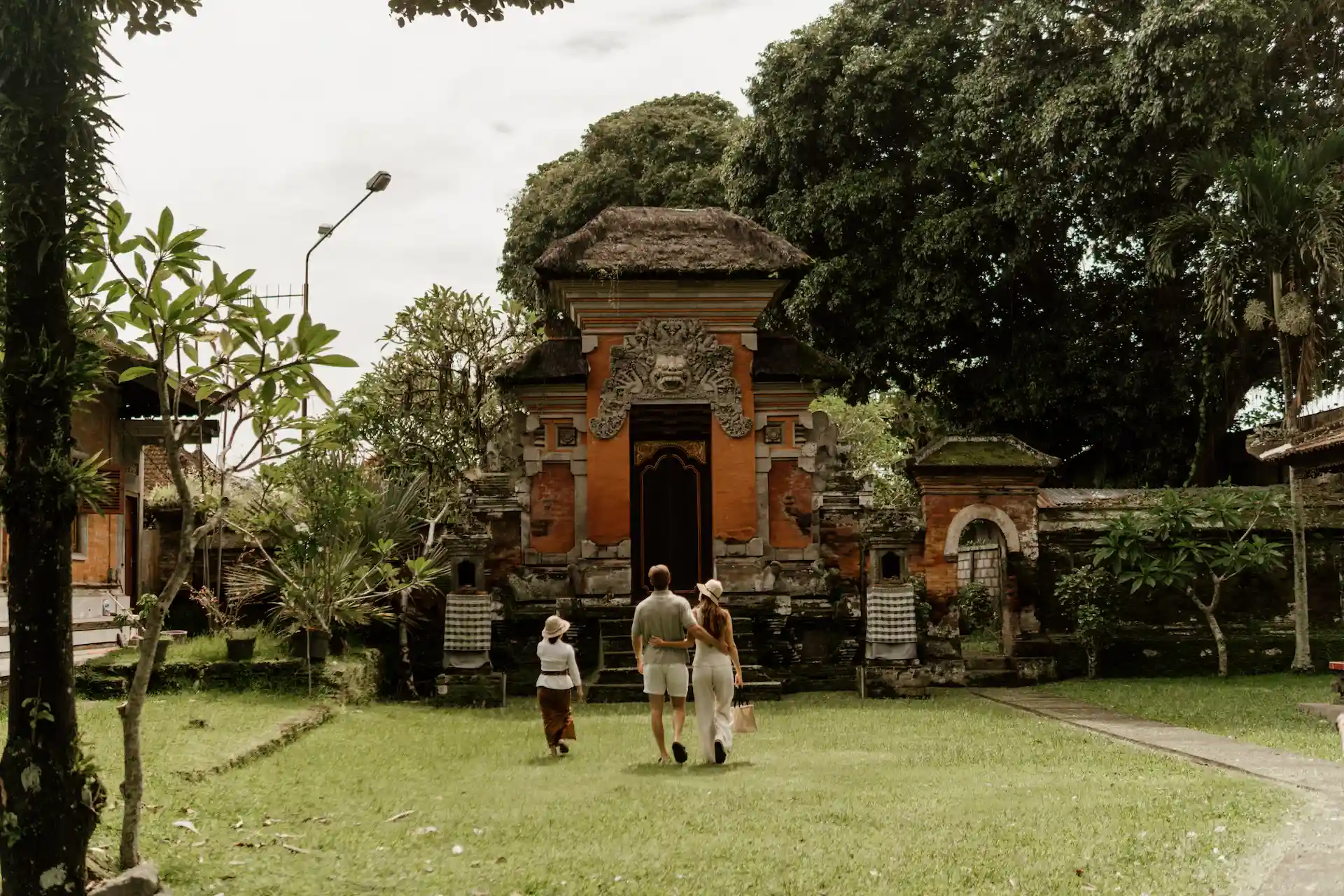 Niang Maar guiding guests at a Balinese temple